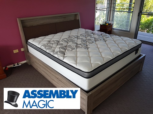 Queen size bed assembled by Assembly Magic. Logo in bottom right corner