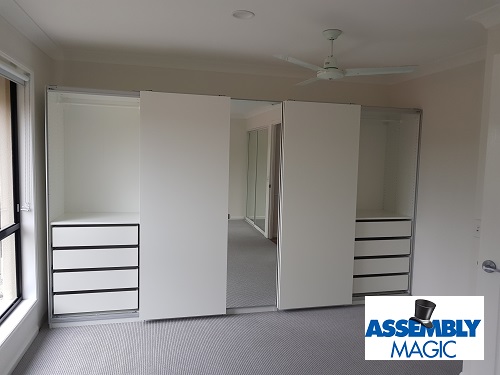 Large flat pack wardrobe set with Assembly Magic logo in bottom right corner