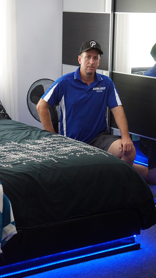 Technician - Ben with a bedroom suite he assembled
