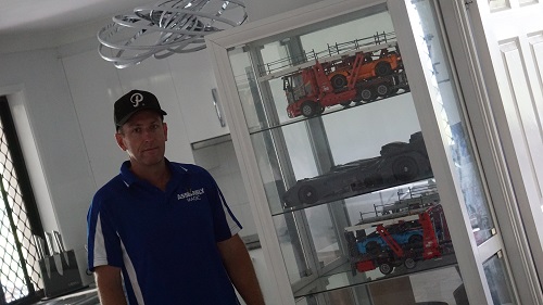 Technician - Ben in front of a Lego cabinet