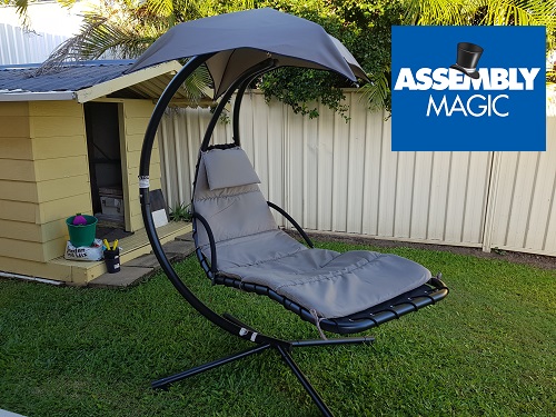Outdoor hanging chair assembled by Assembly Magic. Logo in top right corner.