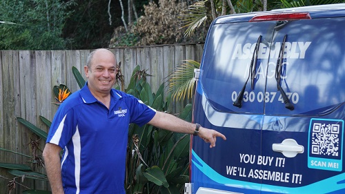 technician - Adam, pointing to phone number on the back of his van