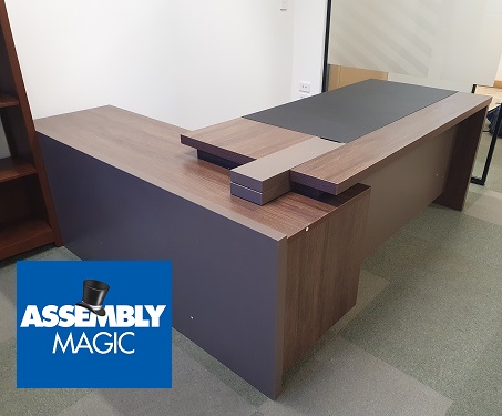 Large Office desk with Assembly Magic logo in bottom left corner