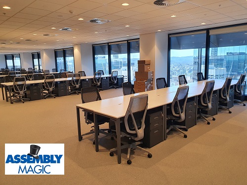 Conference room assembled by Assembly Magic. Logo in bottom left corner