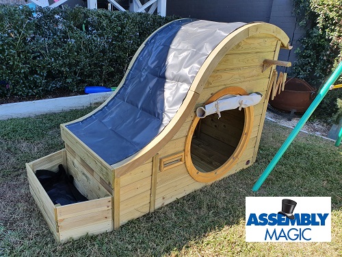 Small children's playground assembled by Assembly Magic. Assembly magic logo in bottom right corner