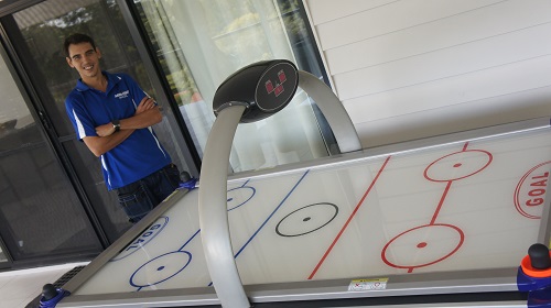 Technician - Shaun with an Air Hockey table he assembled.