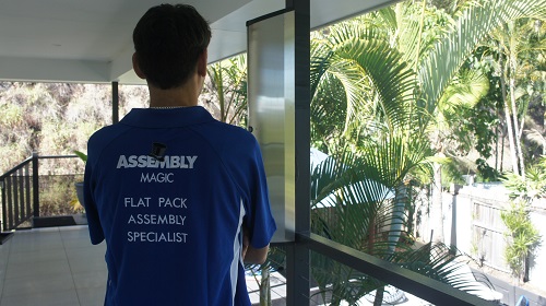 Technician - Shaun, facing with the back of his shirt showing