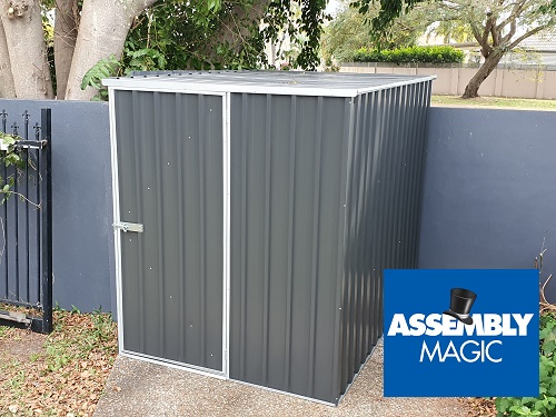 A small garden shed with Assembly Magic logo in bottom right corner