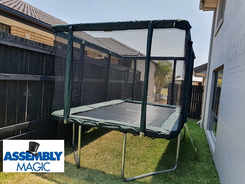 Large rectangular trampoline assembled by Assembly Magic. Assembly Magic logo in bottom left corner