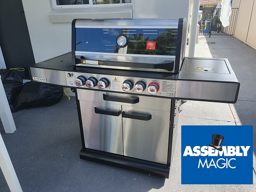 Stainless Steel BBQ with Assembly Magic logo in bottom right corner