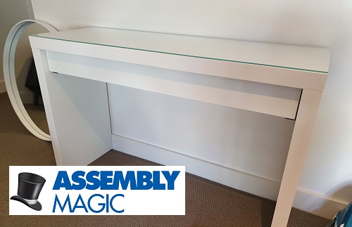 Desk assembled by Assembly Magic. Logo bottom left