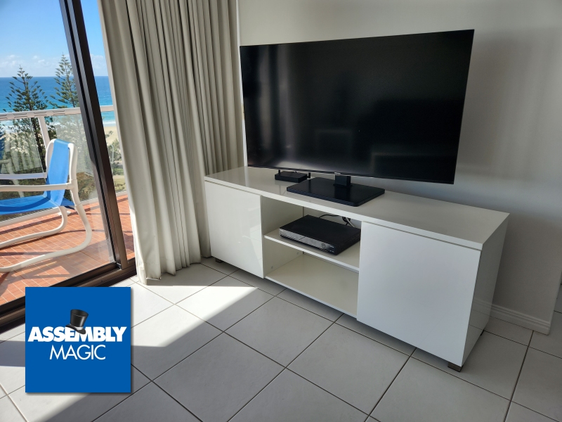 Entertainment Unit with TV on top with Assembly Magic Logo